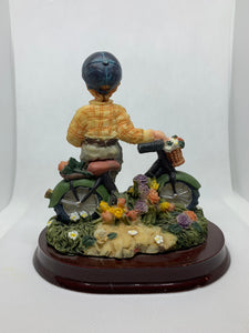 Vintage Figurine Boy Holding White Dove with Bicycle