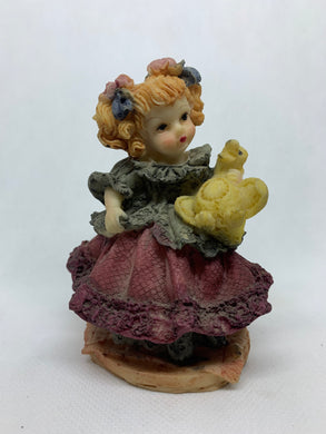Vintage Figurine Girl Holding Stuffed Duck Toy